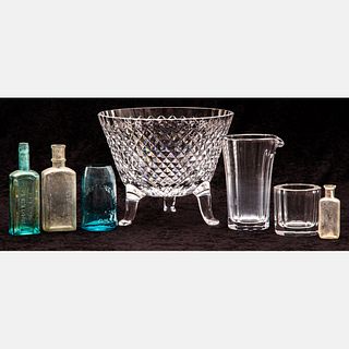 A Group Of Glass Bowls and Bottles