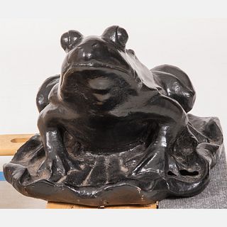 A Cast Metal Frog Form Garden Sculpture