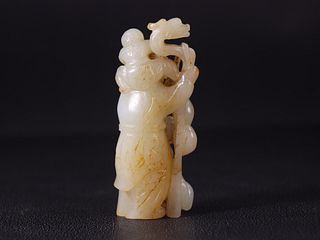A Carved Riverbed Jade 'Longevity' Deity Statue