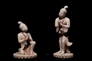 A Group of Two Carved Stone Statues