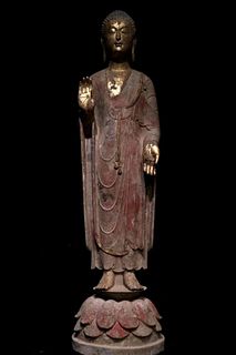 A Carved Stone Standing Buddha Statue