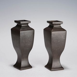 A pair of bronze silver-inlaid vases