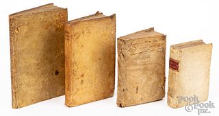 Four vellum bound books