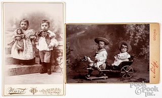 Two cabinet card photographs of children with toys