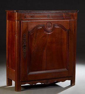 French Provincial Louis XV Style Carved Walnut and Oak Confiturier, 19th c., the stepped rounded corner top over a large fielded panel cupboard door w