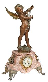French Bronze Patinated Spelter and Marble Mantel Clock, c. 1890, surmounted by a gilt spelter figure of "Amour Chanteur," by J. Chiotti, on a stepped