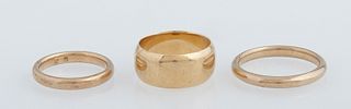 Group of Three 18K Yellow Gold Wedding Bands, early 20th c., one sized 7 3/4, two sized 4 1/2, Wt.- .44 Troy Oz.