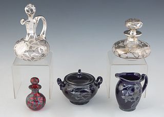 Five Pieces of Sterling Silver Overlay, 20th c., consisting of a Lenox creamer and covered sugar bowl, a cranberry glass perfume bottle, a clear glass