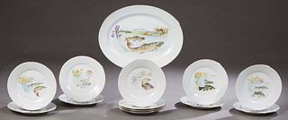 Thirteen Piece French Limoges Porcelain Fish Set, 20th c., by JB, St. Eloi, consisting of twelve circular gilt rimmed plates with transfer fish decora