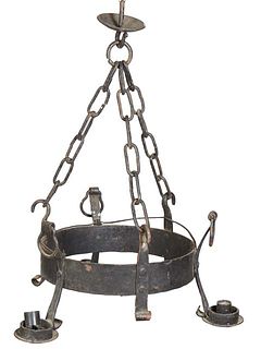 French Provincial Medieval Style Wrought Iron Three Light Chandelier, 20th c., with a canopy and three large chains suspending an iron ring issuing cu