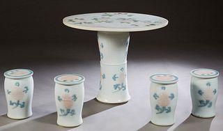 Chinese Porcelain Five Piece Patio Set, 20th c., consisting of a circular table with floral decoration and four cylindrical stools, H.- 29 1/4 in., Di