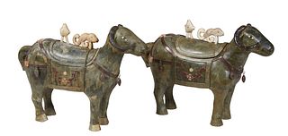Pair of Unusual Oriental Stone Clad Storage Figures, 20th c., of water buffalo, the back with a lift top lid with relief figural handles, the sides wi