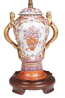 Chinese Porcelain Famille Rose Covered Vase, 19th c., of baluster form, with large gilt salamander handles and a relief rat decorated lip, over intric
