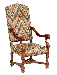 French Carved Oak Louis XV Style Fauteuil a la Reine, 20th c., the canted arched cushioned high back to scrolled leaf carved arms flanking a cushioned
