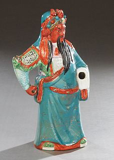 Oriental Glazed Polychromed Porcelain Figure, 20th c., of a standing warrior, lacking one hand, the bottom impressed "16," with an impressed mark, H.-