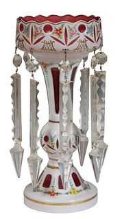 Bohemian Cranberry-to-Clear Glass Luster, late 19th c., with a scalloped rim and gilt tracery decoration, hung with long button and spear prisms, H.- 