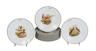 Set of Twelve Limoges Porcelain Game Bird Plates, 20th c., by Limoges Porcelaine, with gilt rims around transfer decoration of game birds, the wide bo