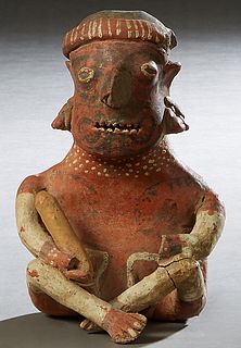 Pre-Columbian Pottery Figure, of a cross legged seated man with a stick in his right hand , with traces of original paint, H.- 8 in., W.- 5 3/8 in., D