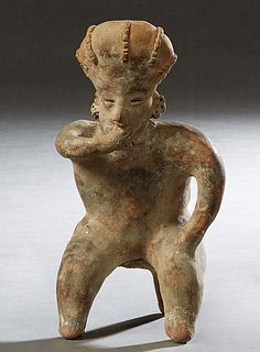 Pre-Columbian Pottery Figure, of a seated man with his hand in his mouth, H.- 10 1/2 in., W.- 5 1/2 in., D.- 4 3/4 in. Provenance: Palmira, the Estate