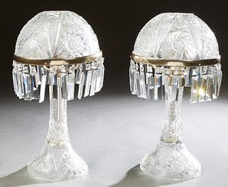 Pair of Cut Glass "Mushroom" Lamps, late 20th c., the domed shades on metal rings hung with button and triangular prisms, on a tapered circular suppor