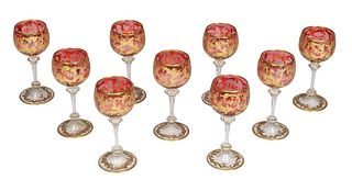 Set of Nine Style Moser Cranberry Gilt Decorated Dessert Wine Glasses, early 20th c., unsigned, H.- 5 3/4 in., Dia.- 2 3/8 in.