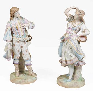 Pair of Continental Polychromed Porcelain Figures, late 19th c., of a man and woman in 19th c., costume, the underside with a blue anchor mark, He- H.