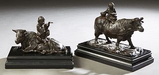 Two Chinese Patinated Bronze Cows, 20th c., with children on their backs, on stepped ebonized wood bases, one of a child playing a flute, the other wi