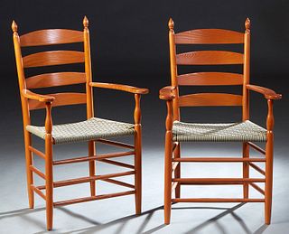 Pair of French Provincial Carved Beech Fautueils, 20th c., arched ladder back over flat curved arms, and a woven striped cloth seat, on turned tapered