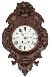 Felix Bidet wall clock Felix Bidet carved wood hanging wall clock, with chime, carved grape and vine motif, paper face with Roman numerals not tested 
