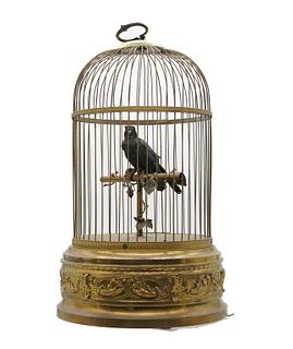 French automaton singing cage French automaton singing cage, featuring a hand feathered automaton singing bird centered on a perch in a brass cage, ci