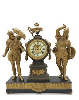 Ansonia Gilt metal figural mantle clock The Gilt metal chiming clock is raised on a footed base, the round movement with winding holes and adorsed fem