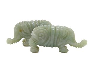 Pair of 19th century Chinese carved elephants Pair of 19th Century Chinese green jade carved elephants.

Size: 1 1/2" H x 2 1/2"W 
