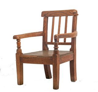 One 19th century oak childâ€™s arm chair One 19th century oak childâ€™s arm chair with open arms and a plank seat raised on rectangular tapered legs a