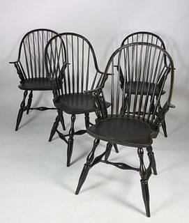 Four Black Painted Continuous Arm Windsor Chairs
