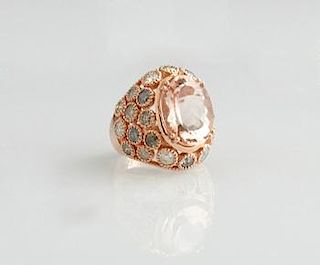Lady's 14K Rose Gold Dinner Ring, with an oval 10.