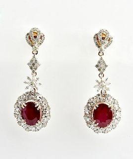 Pair of 14K Pierced Earrings, with diamond mounted
