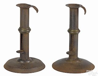 Pair of diminutive tinned sheet iron hogscraper candlesticks, 19th c., with brass wedding rings