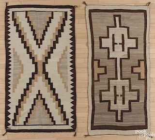 Two Navajo weavings, early 20th c., 68'' x 32'' and 66'' x 36''.