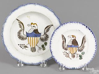 Pearlware blue feather edge cup plate and toddy plate, 19th c., with an American eagle, 4'' dia.