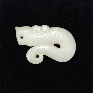 A CARVED WHITE JADE PENDANT 