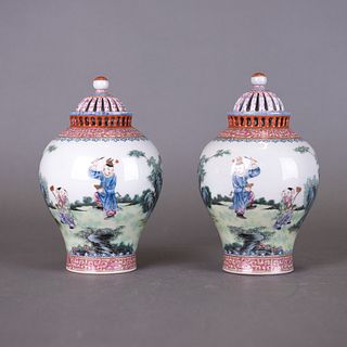 A PAIR OF FAMILLE ROSE 'BOYS' JARS AND COVERS, JIAQING MARK 