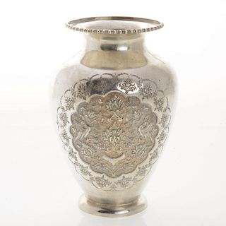 Persian silver vase with repousse floral reserves