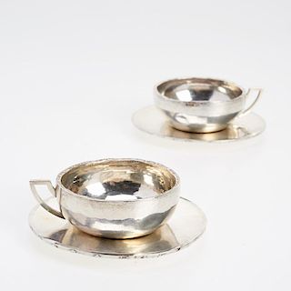 Pair Jean Puiforcat silver cups and saucers