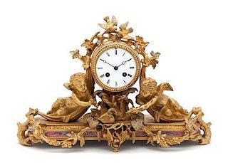 A French Gilt Bronze Figural Mantle Clock Width 18 inches.