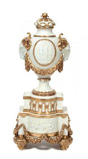 A Continental Gilt Decorated Ceramic Vase Height 25 inches.