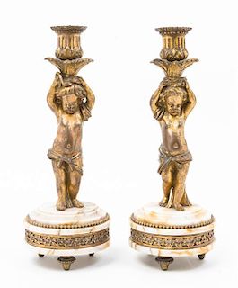 * A Pair of French Gilt Bronze and Marble Figural Candlesticks Height 10 3/4 inches.