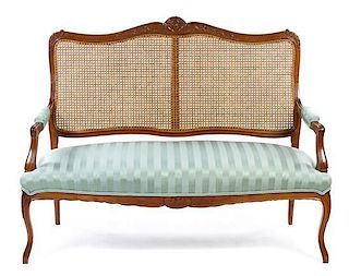 * A Louis XV Style Oak Settee Height 41 x width 51 x depth 20 1/2 inches.