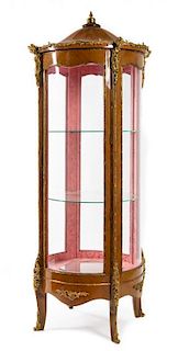 * A Louis XV Style Gilt Metal Mounted Fruitwood Vitrine Height 81 x diameter 34 1/2 inches.