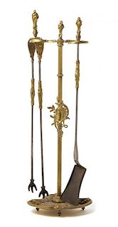 A Set of Louis XV Style Gilt Bronze Fireplace Tools Height 30 1/2 inches.
