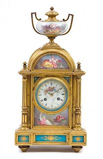 * A Louis XVI Style Porcelain Mounted Gilt Bronze Mantle Clock Height 15 inches.